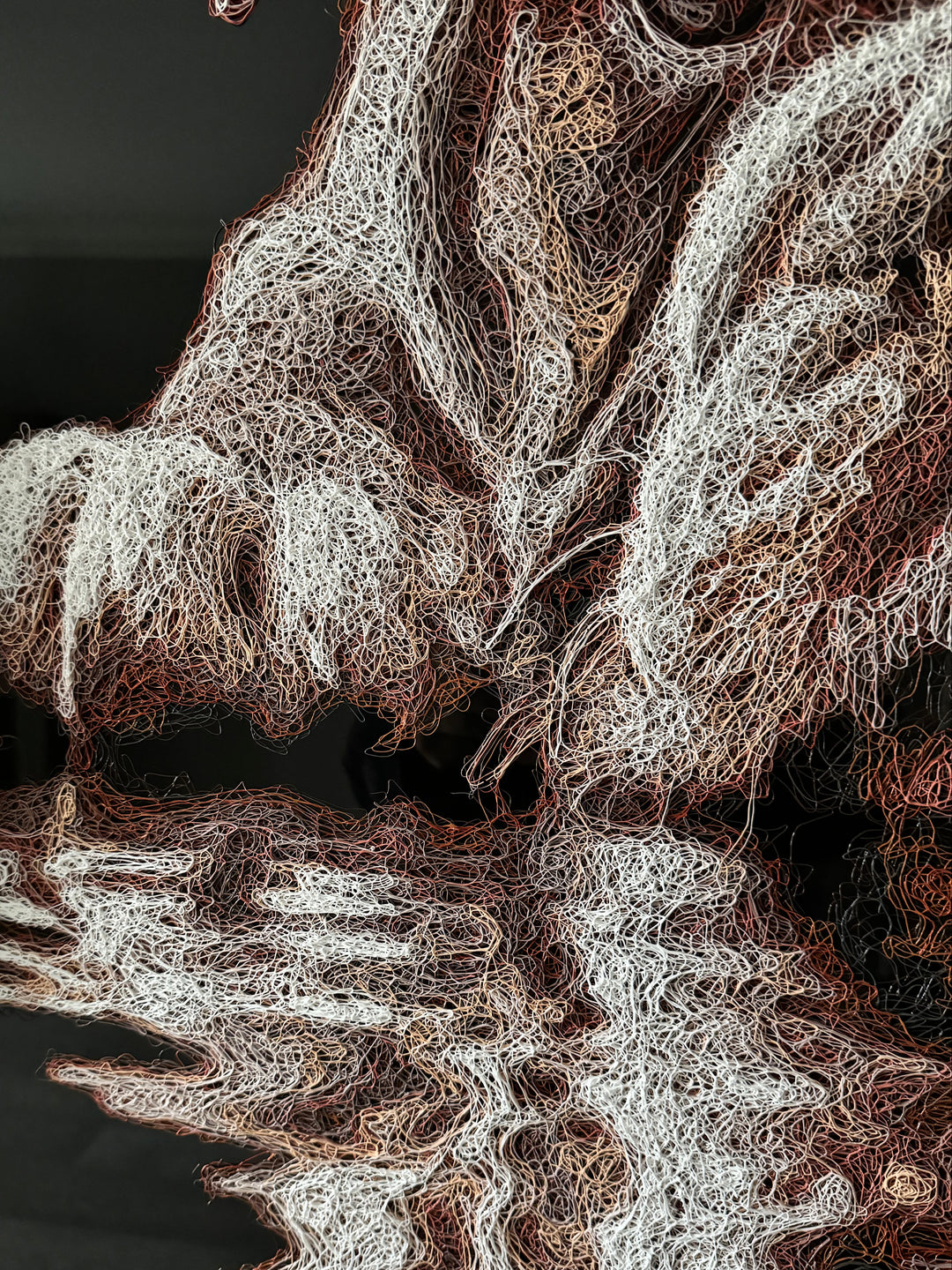 Vibrant injected-scribble artwork of a bulldog puppy resting at the edge of rippling water, its reflection distorted in swirling tones of white, tan, copper and brown, with dense textured linework creating a three-dimensional, energetic surface.