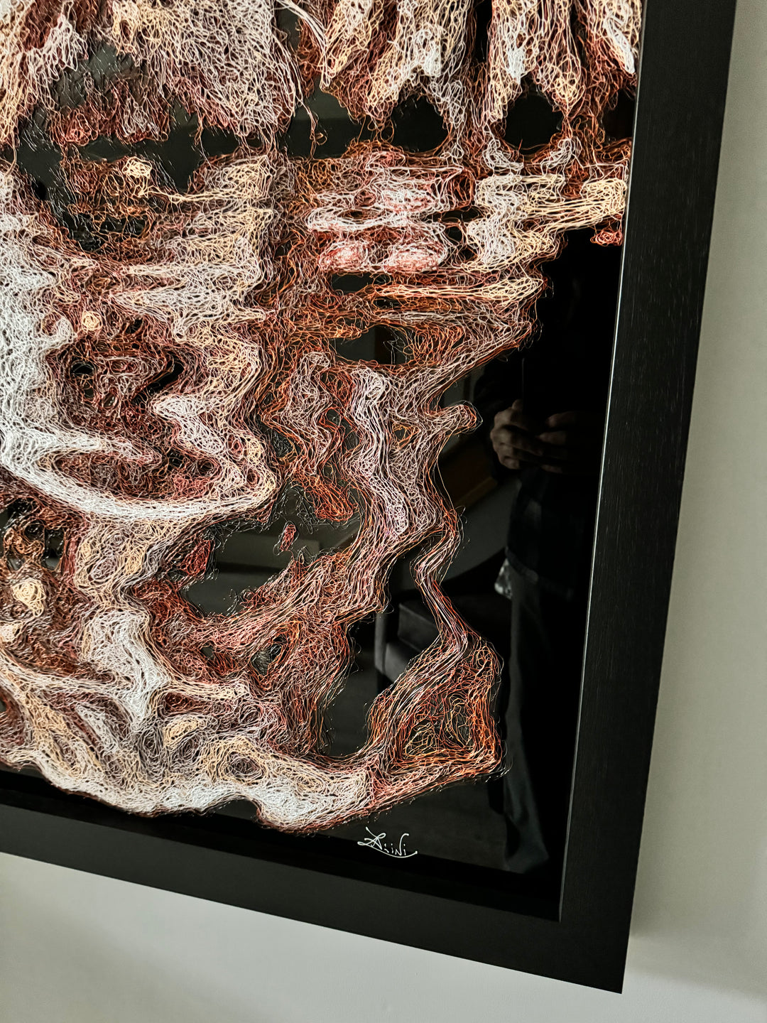 Vibrant injected-scribble artwork of a bulldog puppy resting at the edge of rippling water, its reflection distorted in swirling tones of white, tan, copper and brown, with dense textured linework creating a three-dimensional, energetic surface.