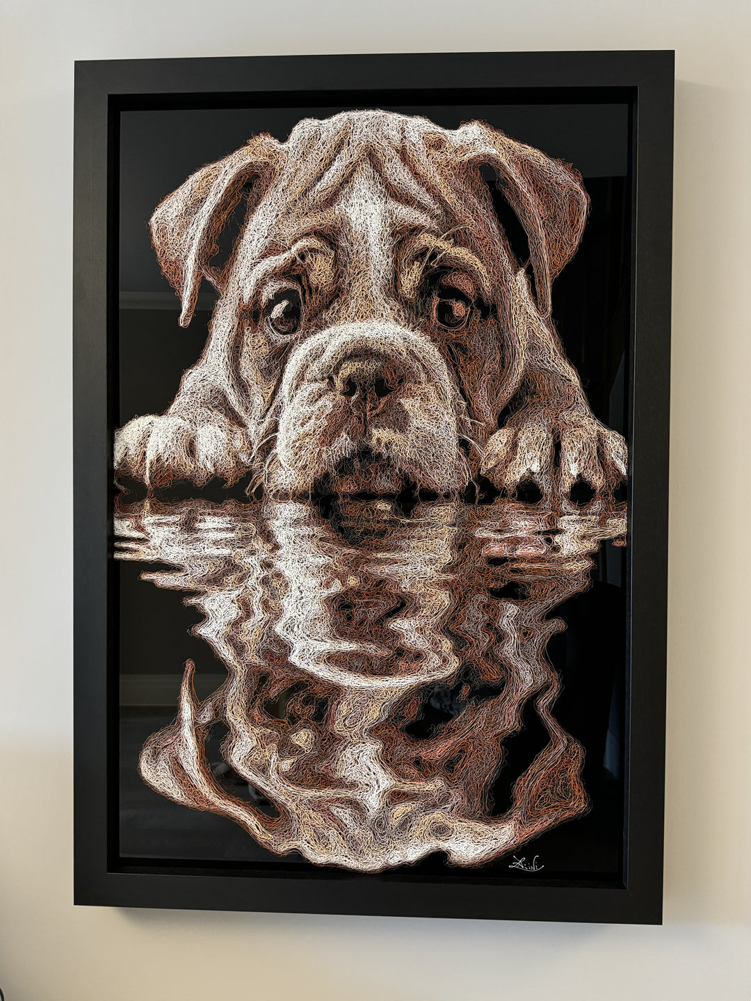 Vibrant injected-scribble artwork of a bulldog puppy resting at the edge of rippling water, its reflection distorted in swirling tones of white, tan, copper and brown, with dense textured linework creating a three-dimensional, energetic surface.