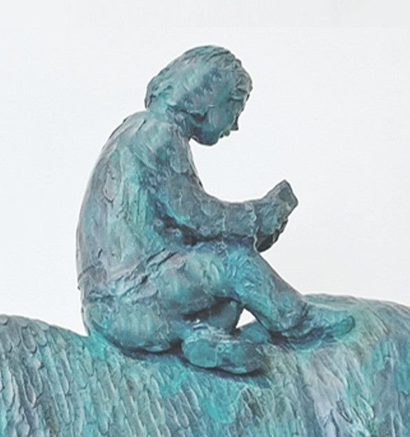 Lost in the Calmness of Reading by Ian Marlow - a limited edition bronze sculpture depicting a young figure seated atop a grazing horse, absorbed in a book, with a textured surface and serene presence.