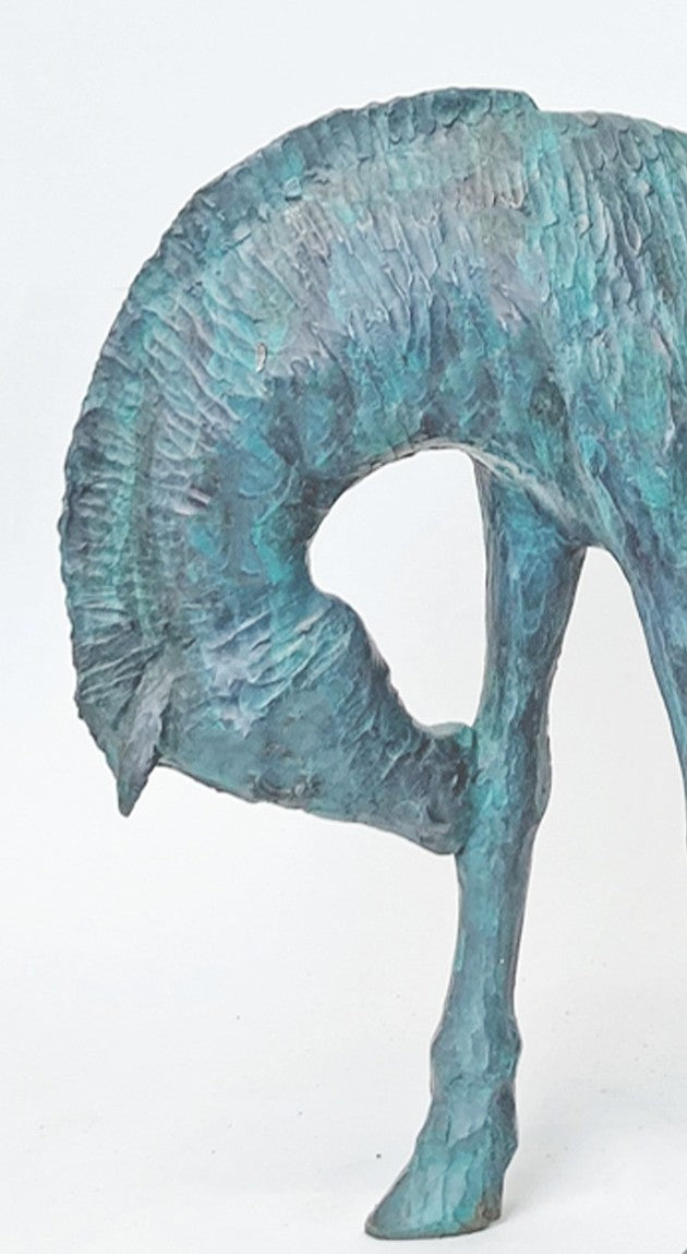 Lost in the Calmness of Reading by Ian Marlow - a limited edition bronze sculpture depicting a young figure seated atop a grazing horse, absorbed in a book, with a textured surface and serene presence.