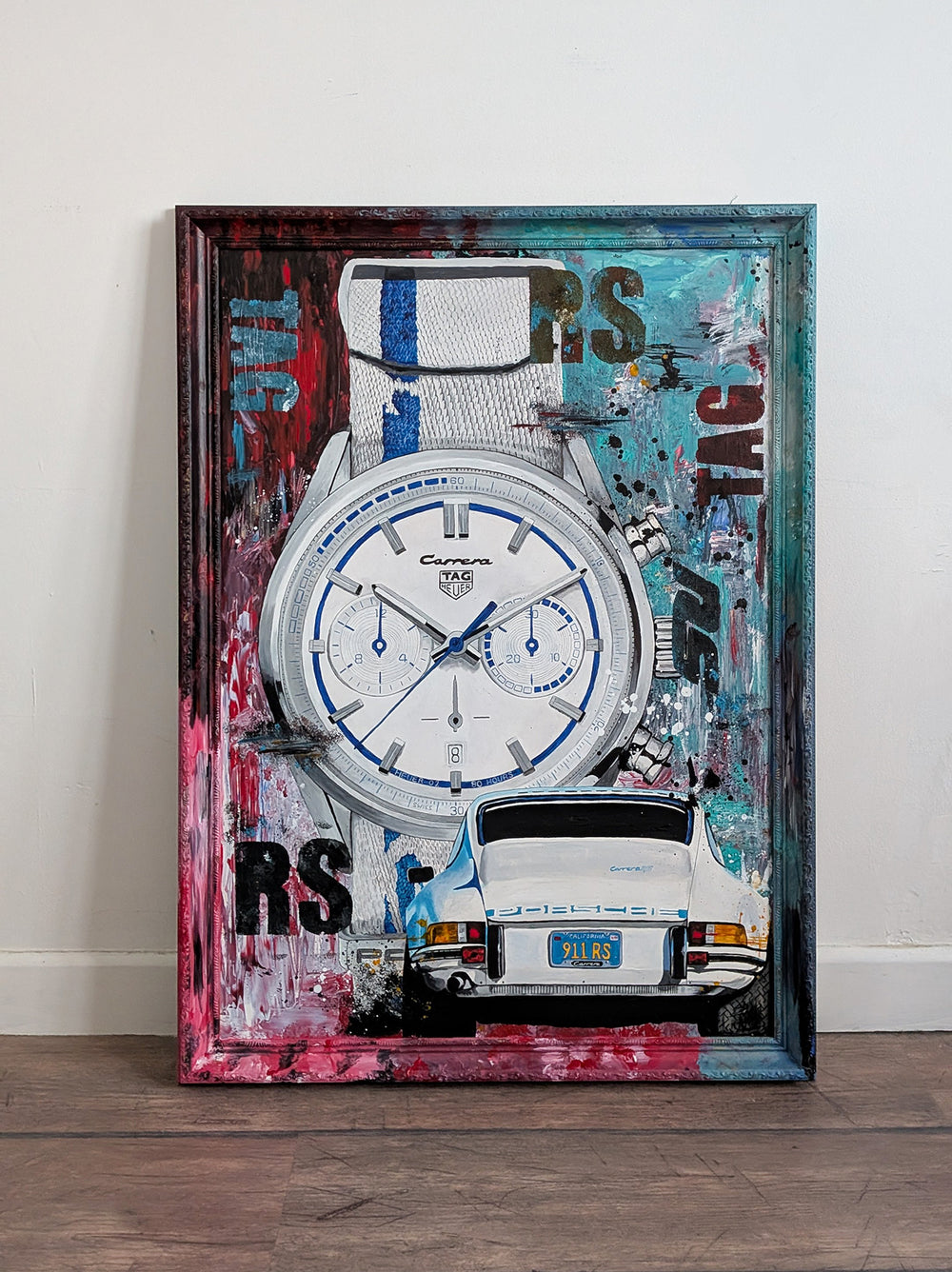 Embellished limited edition print featuring a TAG Heuer Carrera x Porsche 911 2.7 RS watch alongside a rear view of a classic white Porsche, set against a vivid abstract backdrop of teal, red, pink, and black, all encased in a custom livery-painted frame.