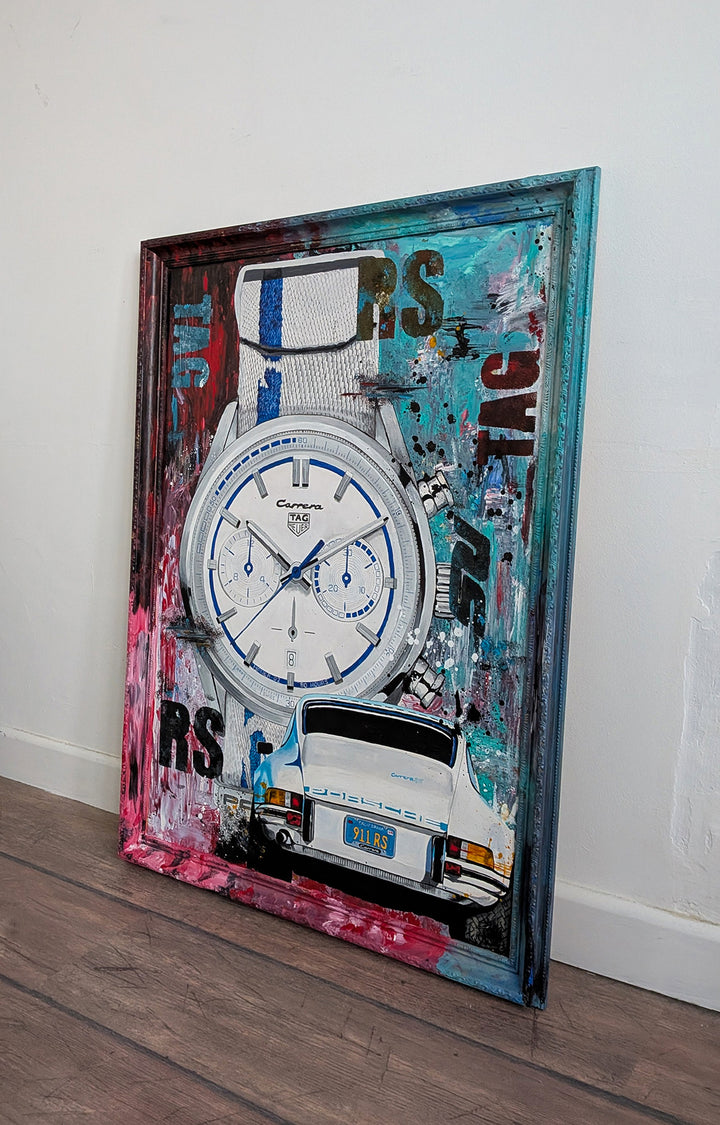Embellished limited edition print featuring a TAG Heuer Carrera x Porsche 911 2.7 RS watch alongside a rear view of a classic white Porsche, set against a vivid abstract backdrop of teal, red, pink, and black, all encased in a custom livery-painted frame.