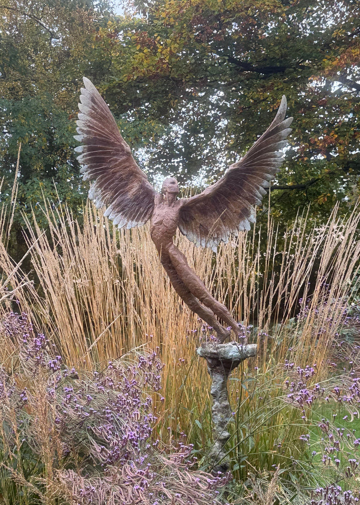 “Icarus IX” by Nicola Godden – a limited edition bronze sculpture depicting Icarus rising skyward, wings outstretched in a gesture of freedom and ascent. Cast in warm bronze tones with sunlit patina, handmade in England, edition of nine.