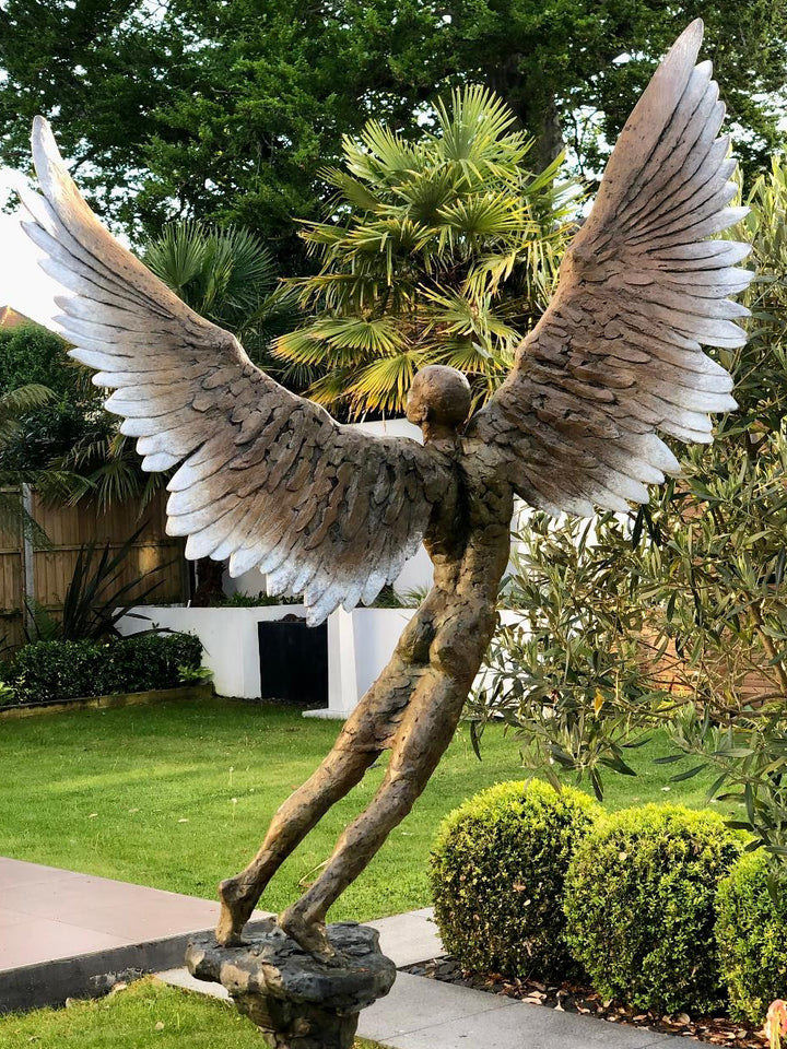 “Icarus IX” by Nicola Godden – a limited edition bronze sculpture depicting Icarus rising skyward, wings outstretched in a gesture of freedom and ascent. Cast in warm bronze tones with sunlit patina, handmade in England, edition of nine.