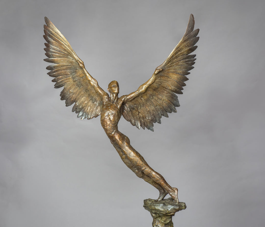 “Icarus IX” by Nicola Godden – a limited edition bronze sculpture depicting Icarus rising skyward, wings outstretched in a gesture of freedom and ascent. Cast in warm bronze tones with sunlit patina, handmade in England, edition of nine.