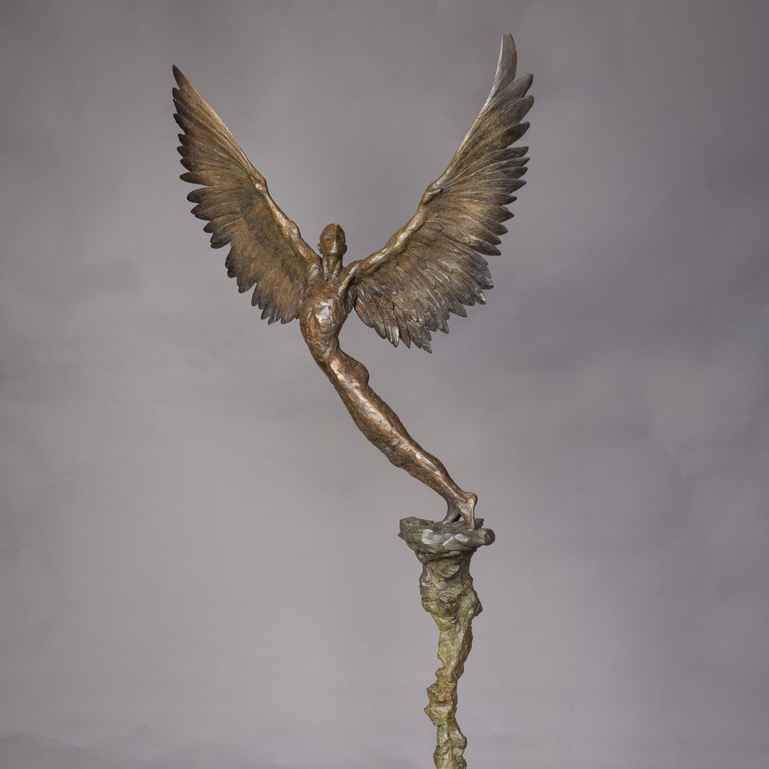 “Icarus IX” by Nicola Godden – a limited edition bronze sculpture depicting Icarus rising skyward, wings outstretched in a gesture of freedom and ascent. Cast in warm bronze tones with sunlit patina, handmade in England, edition of nine.