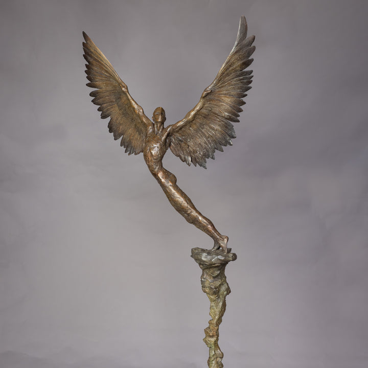 “Icarus IX” by Nicola Godden – a limited edition bronze sculpture depicting Icarus rising skyward, wings outstretched in a gesture of freedom and ascent. Cast in warm bronze tones with sunlit patina, handmade in England, edition of nine.