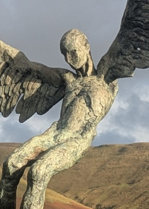 “Icarus X” by Nicola Godden – a limited edition bronze sculpture depicting Icarus falling from the sky, his wings extended in descent. Cast with a blue ocean-inspired patina, this handmade British bronze captures both tragedy and grace.