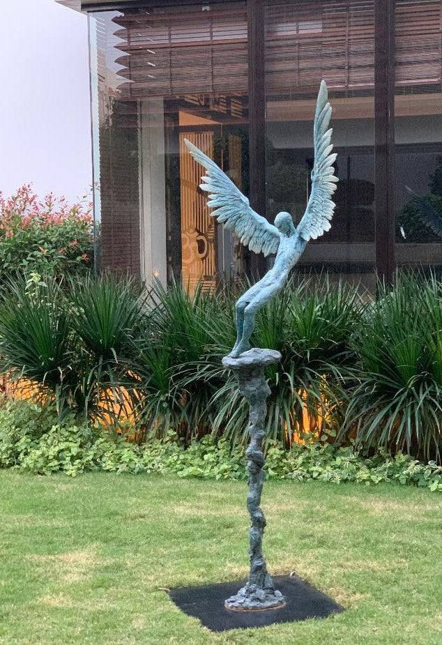 “Icarus X” by Nicola Godden – a limited edition bronze sculpture depicting Icarus falling from the sky, his wings extended in descent. Cast with a blue ocean-inspired patina, this handmade British bronze captures both tragedy and grace.