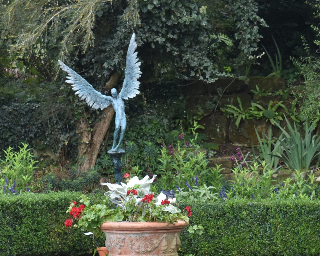 “Icarus X” by Nicola Godden – a limited edition bronze sculpture depicting Icarus falling from the sky, his wings extended in descent. Cast with a blue ocean-inspired patina, this handmade British bronze captures both tragedy and grace.