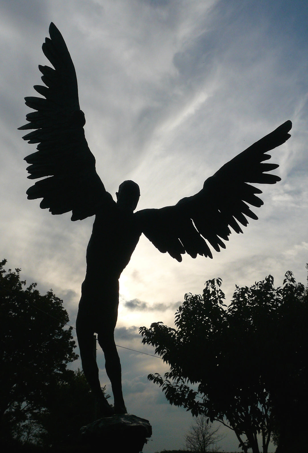 “Icarus X” by Nicola Godden – a limited edition bronze sculpture depicting Icarus falling from the sky, his wings extended in descent. Cast with a blue ocean-inspired patina, this handmade British bronze captures both tragedy and grace.