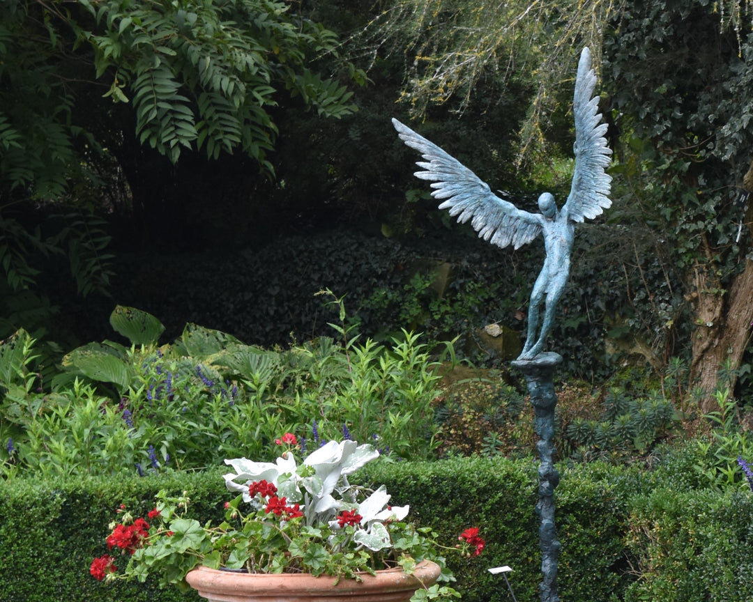 “Icarus X” by Nicola Godden – a limited edition bronze sculpture depicting Icarus falling from the sky, his wings extended in descent. Cast with a blue ocean-inspired patina, this handmade British bronze captures both tragedy and grace.