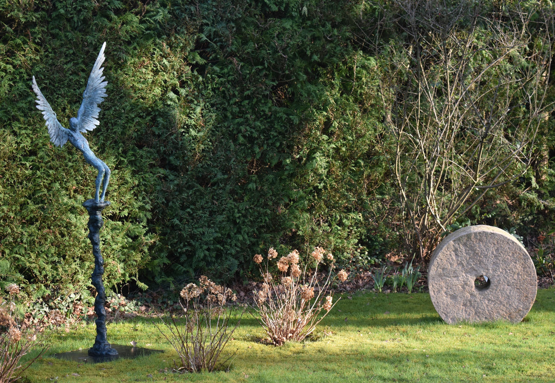 “Icarus X” by Nicola Godden – a limited edition bronze sculpture depicting Icarus falling from the sky, his wings extended in descent. Cast with a blue ocean-inspired patina, this handmade British bronze captures both tragedy and grace.