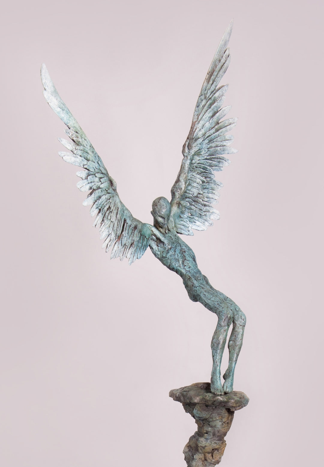 “Icarus X” by Nicola Godden – a limited edition bronze sculpture depicting Icarus falling from the sky, his wings extended in descent. Cast with a blue ocean-inspired patina, this handmade British bronze captures both tragedy and grace.