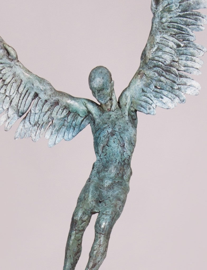 “Icarus X” by Nicola Godden – a limited edition bronze sculpture depicting Icarus falling from the sky, his wings extended in descent. Cast with a blue ocean-inspired patina, this handmade British bronze captures both tragedy and grace.