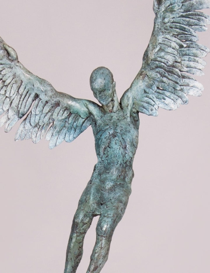 “Icarus X” by Nicola Godden – a limited edition bronze sculpture depicting Icarus falling from the sky, his wings extended in descent. Cast with a blue ocean-inspired patina, this handmade British bronze captures both tragedy and grace.