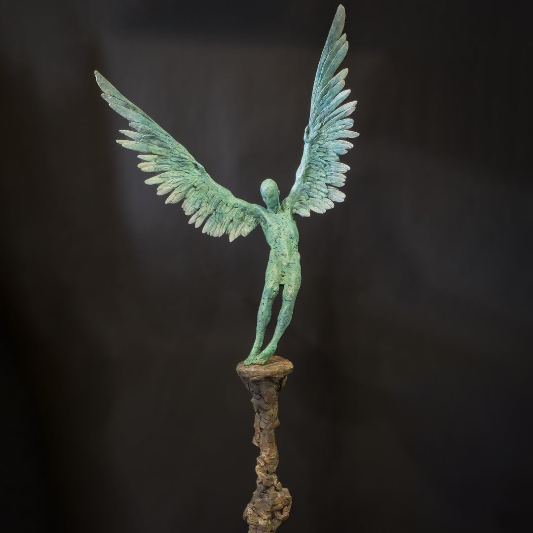 “Icarus X” by Nicola Godden – a limited edition bronze sculpture depicting Icarus falling from the sky, his wings extended in descent. Cast with a blue ocean-inspired patina, this handmade British bronze captures both tragedy and grace.