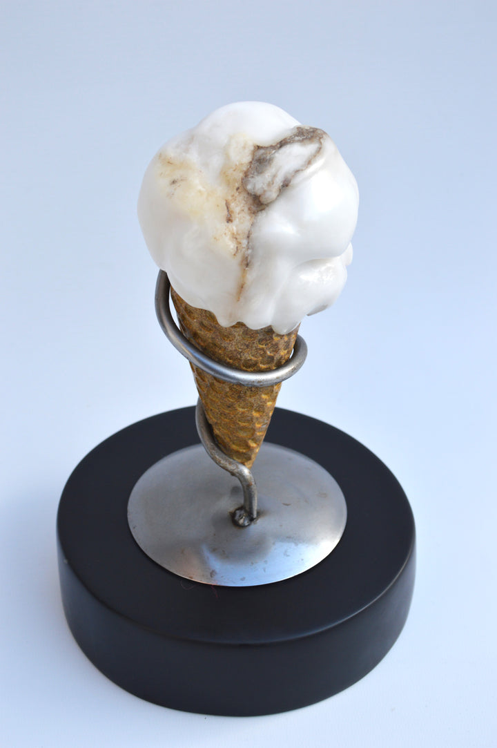 Deborah Harrison alabaster sculpture Ice Cream, one-off artwork featuring a hand-carved alabaster scoop with natural cream and golden brown veining, set in an Ancaster limestone cone, secured by a polished steel spiral holder on a slate base, blending playfulness with fine craftsmanship.
