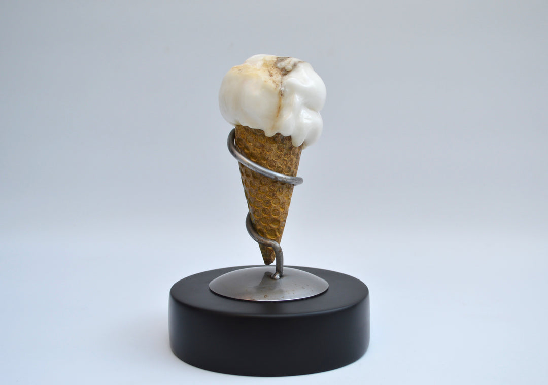 Deborah Harrison alabaster sculpture Ice Cream, one-off artwork featuring a hand-carved alabaster scoop with natural cream and golden brown veining, set in an Ancaster limestone cone, secured by a polished steel spiral holder on a slate base, blending playfulness with fine craftsmanship.