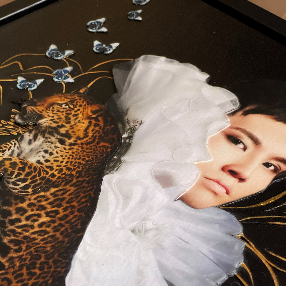 Catarina Diaz’s I Found You, analogue collage on Somerset Enhanced Velvet with oil on gesso-primed canvas. Portrait of a figure in voluminous white ruffled collar, accompanied by a leaping leopard, surrounded by delicate blue butterflies and fine gold linework.