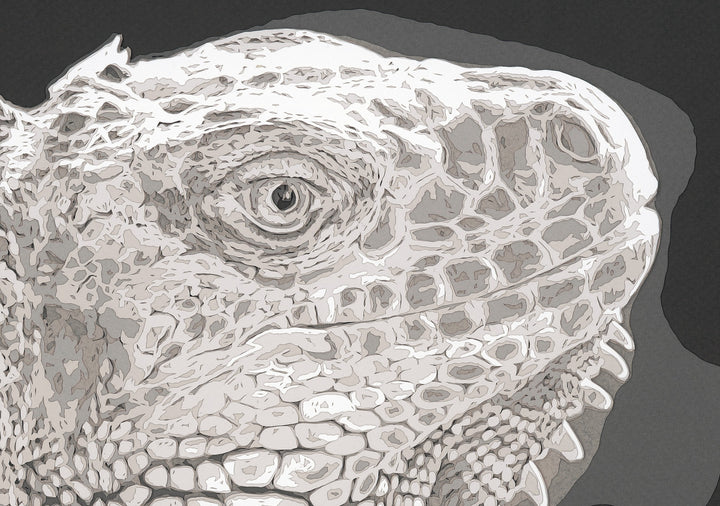 Hand-cut paper artwork of an iguana, showcasing its intricate scales and textured ridges in layered tones of ivory, taupe, and soft grey. Each scale is individually cut, creating a strikingly lifelike, prehistoric presence against a deep charcoal background.