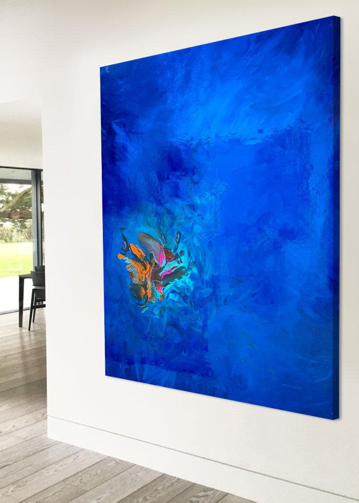 Large abstract painting “Into the Blue” by Swarez — deep ocean-inspired composition with layered shades of cobalt, ultramarine, turquoise, and teal blue. Vivid bursts of fiery orange, vibrant fuchsia, aqua, and rich purple emerge in the centre, with swirling, glossy enamel textures creating movement and depth.