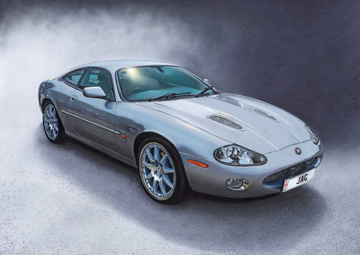 Limited edition giclée print by Ray West depicting a hyper-realistic pastel artwork of a silver Jaguar sports car, shown in three-quarter view with refined reflections and atmospheric depth, reproduced on archival quality fine art paper.