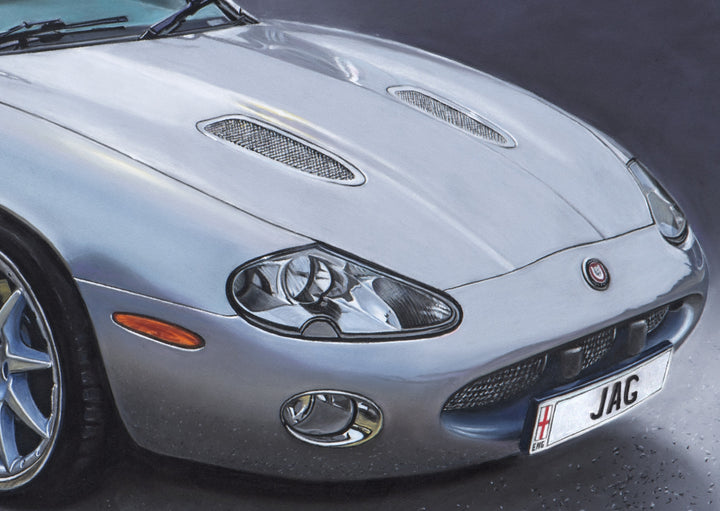 Limited edition giclée print by Ray West depicting a hyper-realistic pastel artwork of a silver Jaguar sports car, shown in three-quarter view with refined reflections and atmospheric depth, reproduced on archival quality fine art paper.