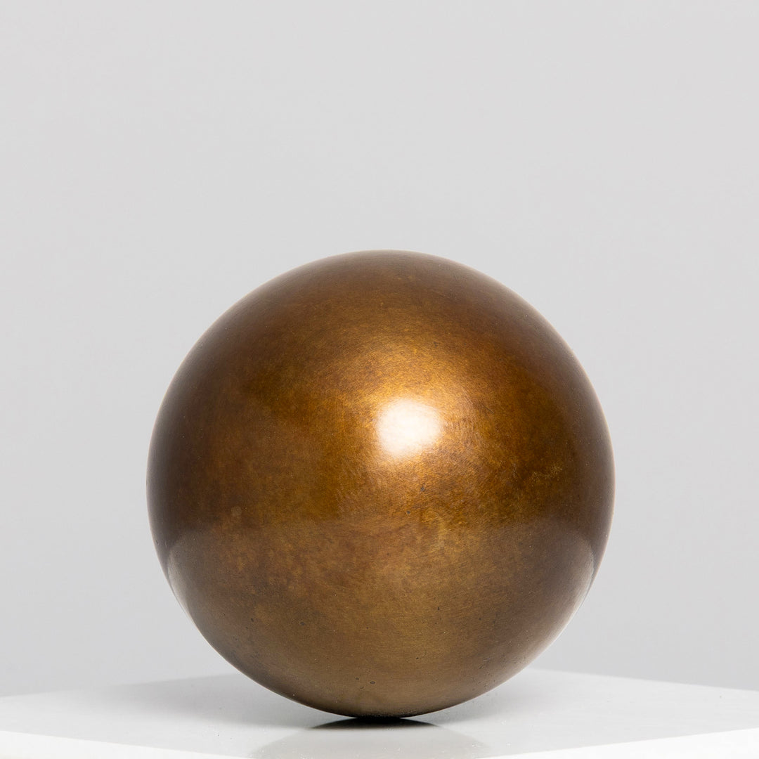 Patinated bronze Creation egg sculpture by James Parker, with a smooth rounded form symbolising fragility, containment, potential and birth.