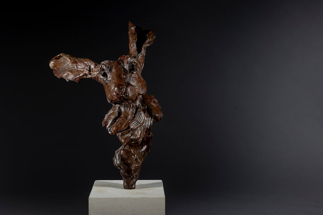 Expressive bronze sculpture of a hare’s head with exaggerated upright ears, mounted on a smooth Portland stone base.