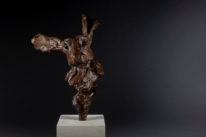Expressive bronze sculpture of a hare’s head with exaggerated upright ears, mounted on a smooth Portland stone base.
