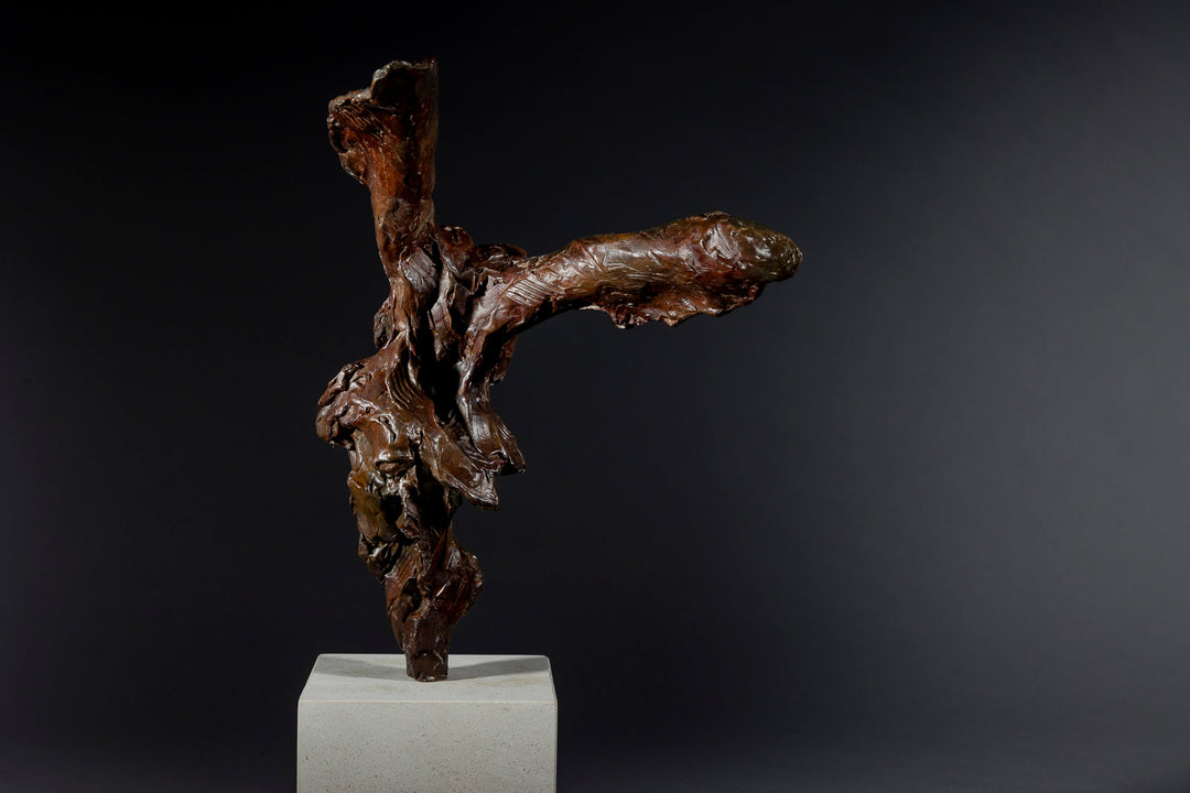Expressive bronze sculpture of a hare’s head with exaggerated upright ears, mounted on a smooth Portland stone base.
