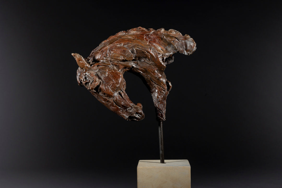 Bronze sculpture of an arched horse head with expressive detailing, mounted on a minimalist Portland stone base against a soft neutral backdrop.