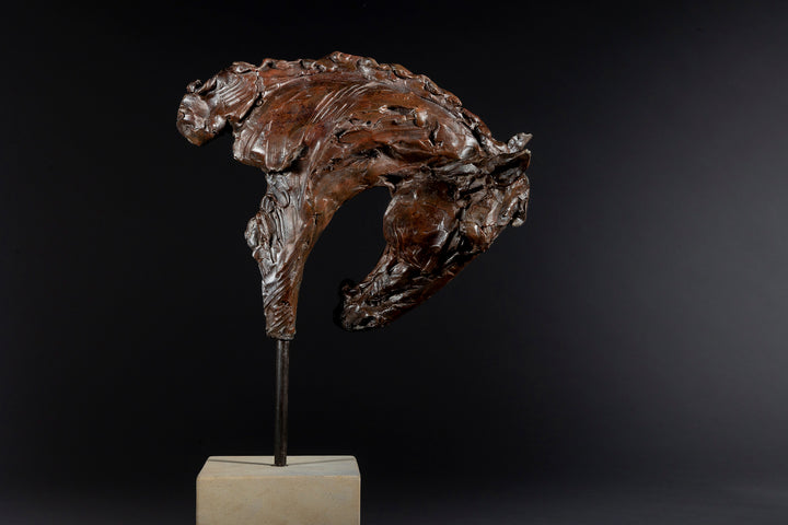 Bronze sculpture of an arched horse head with expressive detailing, mounted on a minimalist Portland stone base against a soft neutral backdrop.