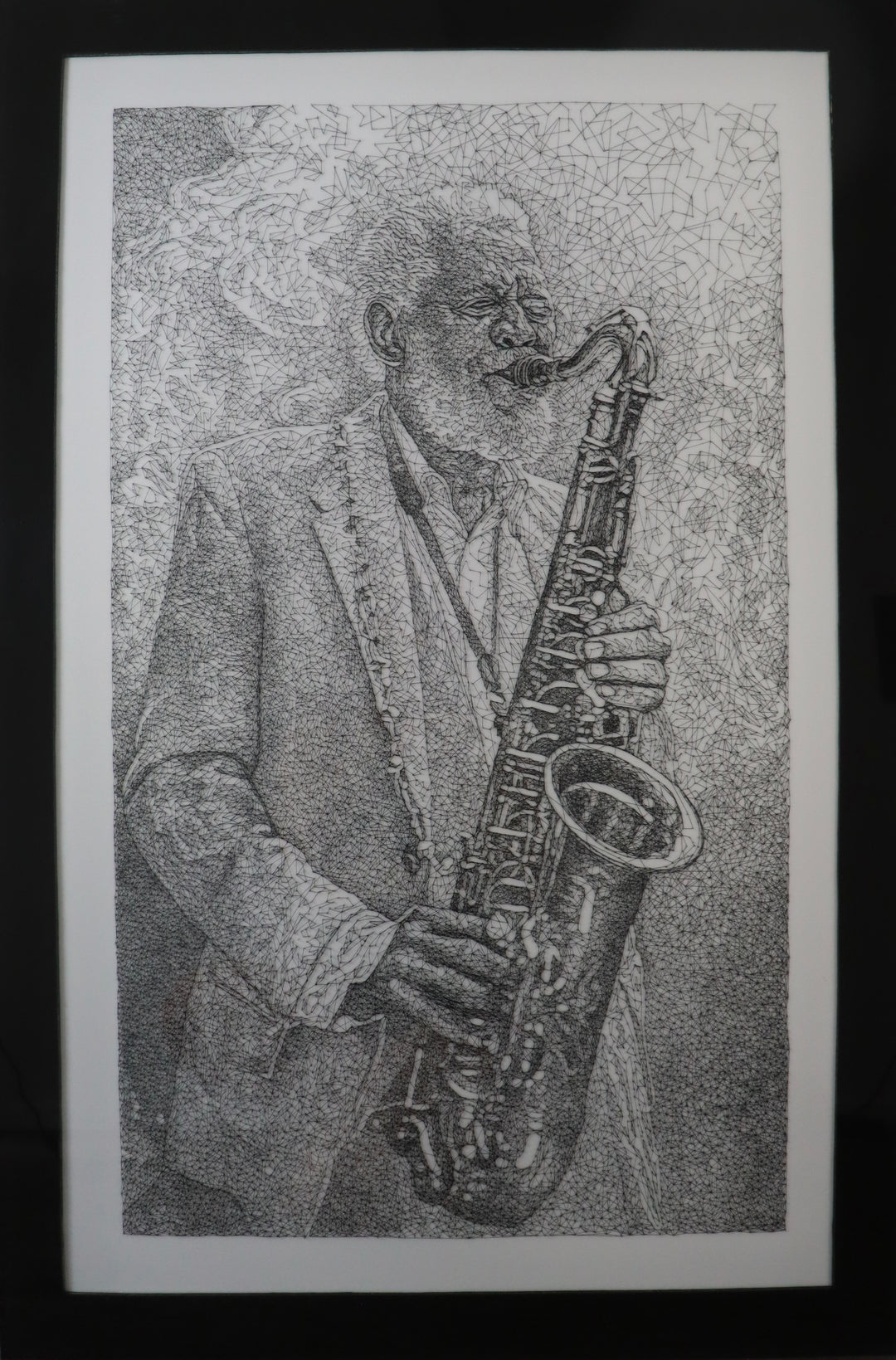 Highly detailed string art portrait of a jazz musician playing a saxophone, created using thousands of black threads stretched between pins on a white background.
