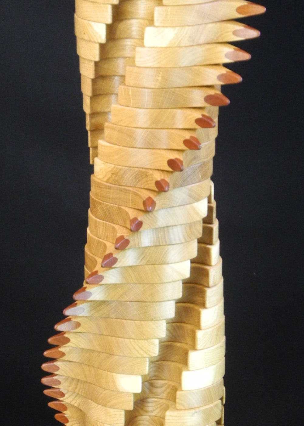 Lacuna Table 2 by Max McCance — a one-off sculptural table in oak and mahogany with a twisting double-helix column and sharp mahogany points spiralling upward beneath a round oak top and base.