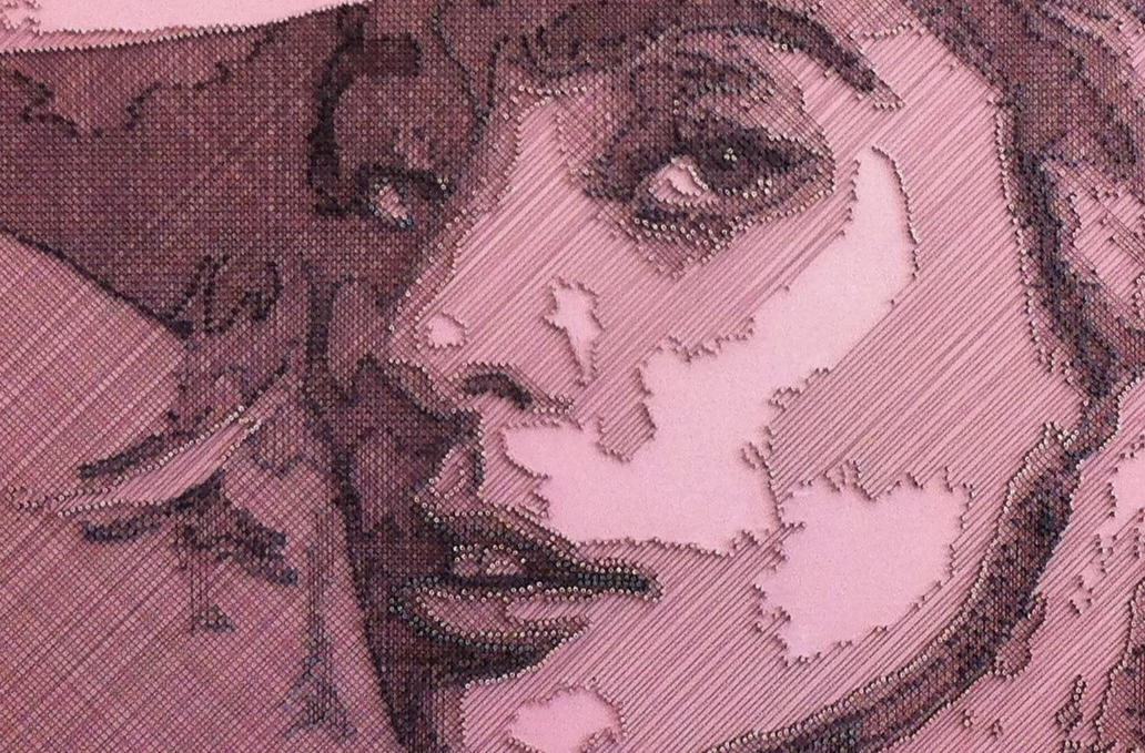 Portrait of Lady Gaga constructed from fine copper wire tensioned around numerous small nails on a painted board, with layered linear wiring forming facial features, hair and hat through tonal variation, depth and shadow across a textured pink-toned surface.