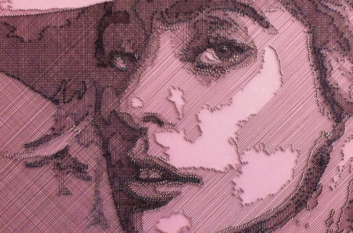 Portrait of Lady Gaga constructed from fine copper wire tensioned around numerous small nails on a painted board, with layered linear wiring forming facial features, hair and hat through tonal variation, depth and shadow across a textured pink-toned surface.