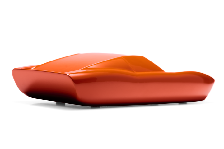 ‘Lamborghini Miura’ by Srini Gandra, a limited-edition contemporary automotive sculpture from the Forme di Velocità series, inspired by the legendary Lamborghini Miura designed by Marcello Gandini at Bertone. Presented in a vibrant high-gloss Arancio Miura orange finish, the sculpture captures the supercar's low, flowing silhouette, elongated bonnet, sculpted wheel arches, sweeping side contours and distinctive fastback profile. Its smooth, minimalist surfaces celebrate the aerodynamic elegance and timeless