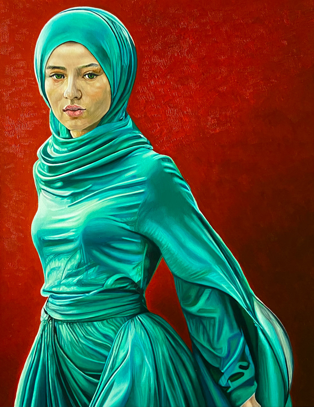 Oil painting by Dide Siemmond depicting a woman in a flowing turquoise and emerald-green dress and headscarf against a richly textured deep red background. Rendered with precise realism, her calm, direct gaze is framed by luminous fabric that wraps and folds around the body, catching light and creating subtle transparency. The contrast between cool green garments and the warm red ground gives the portrait quiet intensity, blending contemporary figurative painting with layered conceptual symbolism.