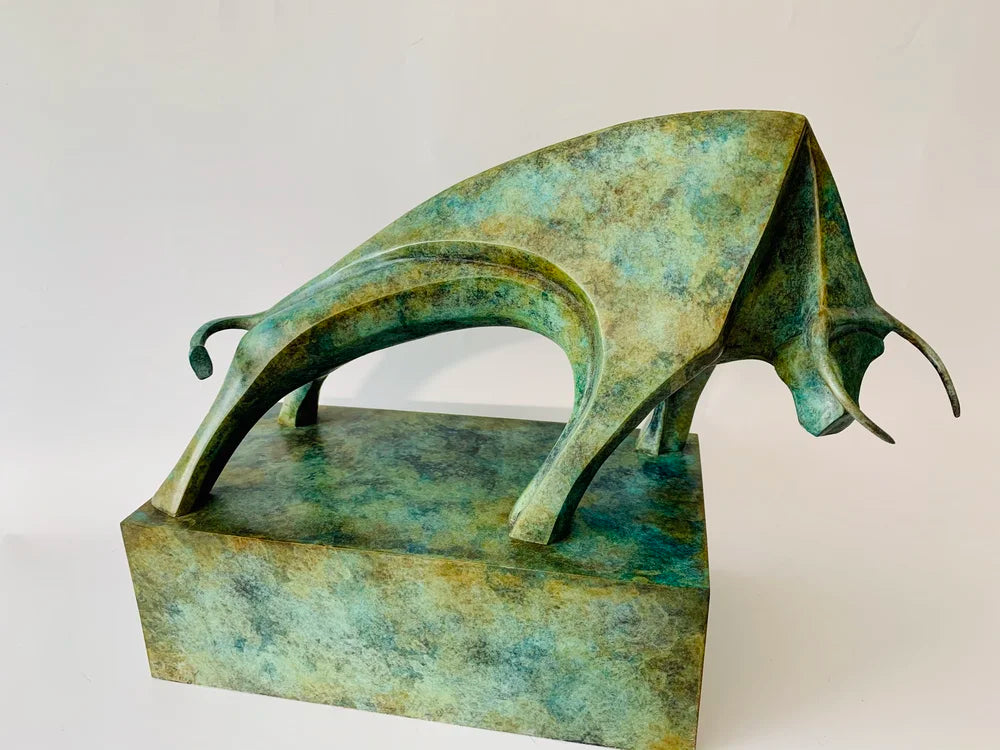 Marie Ackers Le Taureau bronze bull sculpture with striking green patina, poised in a powerful forward stance on a fabricated bronze base. Limited edition of 8, signed, numbered, and foundry stamped with certificate of authenticity.