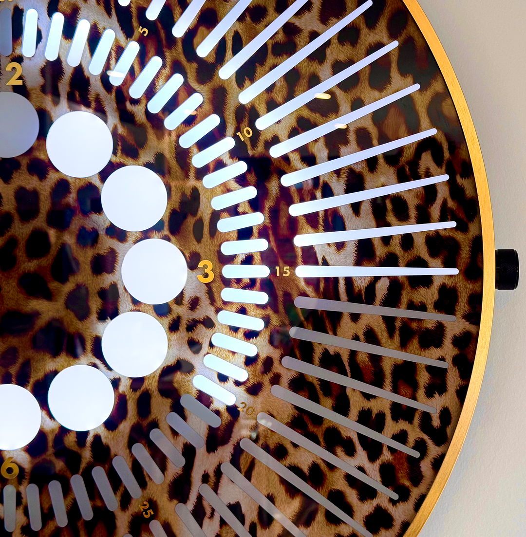 “Tempus Leopard Edition” by Ben Rousseau – a limited-edition illuminated timepiece crafted from leopard-printed glass and brass-tinted aluminium with LEDs. A bold fusion of glamour, light, and contemporary design.

