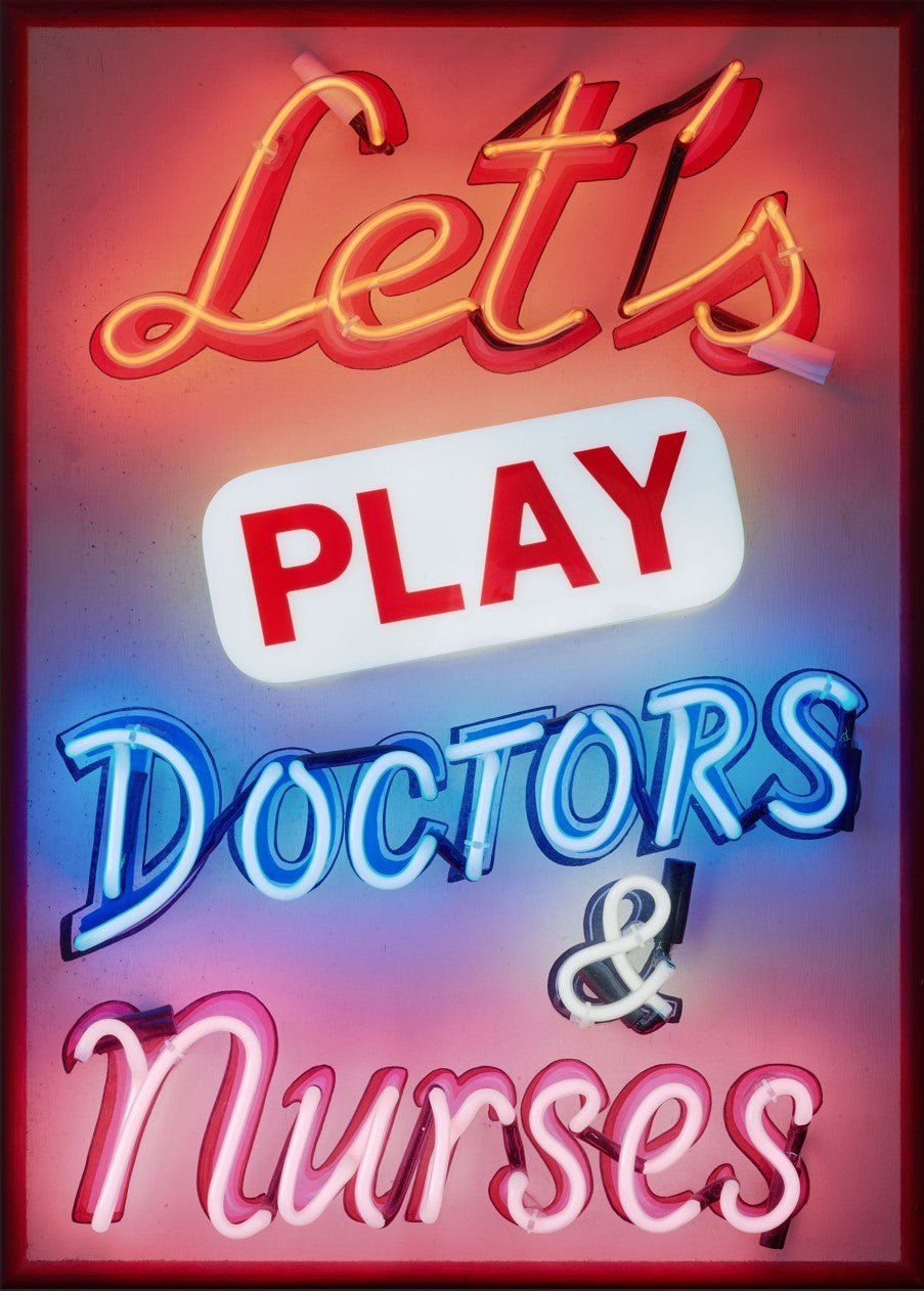 A vibrant neon sign artwork by Matthew Bracey reading “Let’s Play Doctors & Nurses.” The piece features glowing script and block fonts in red, white, blue, and pink neon set against a dark framed background, combining retro humour with bold visual impact.