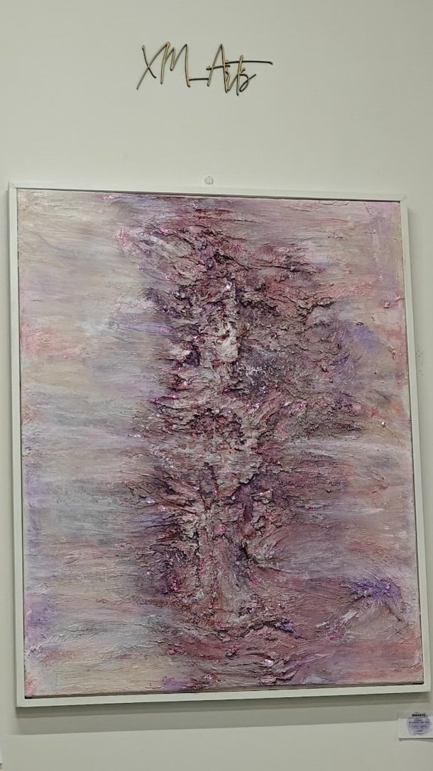 Textured abstract painting with central vertical ridge in soft pink, mauve, and lavender tones, creating an organic, layered effect


