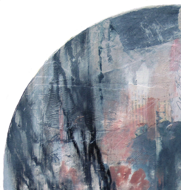A moody, ethereal mixed media painting by Toni Cogdell on a circular wood panel. Layers of acrylic, oil paint, and collage materials form a soft, ghost-like portrait that seems to emerge from and dissolve into the surface. Tones of charcoal grey, rose, cream, and pale blue are applied with expressive texture and gestural marks, creating a mysterious, almost dreamlike presence. Subtle botanical impressions and abstract forms weave through the surface, adding to the artwork’s sense of quiet contemplation.