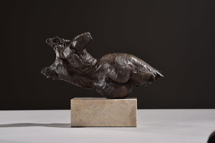 ‘Nude Emergence Torso’ by Hamish Mackie, a limited-edition contemporary bronze figurative sculpture depicting a fragmented reclining female nude torso. Inspired by ancient sculptural artefacts, the abstracted human form features rough, expressive modelling, weathered surfaces and an earthy brown bronze patina. Mounted horizontally on a rectangular Ancaster Weatherbed stone plinth, the sculpture explores the natural beauty and tactile qualities of the female form.