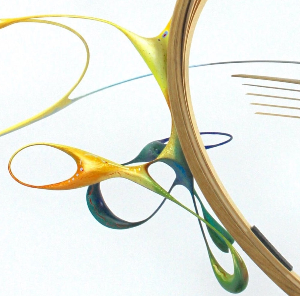 Freedom by Mark Purllant, an award-winning one-off mixed media sculpture in carved and steam-bent English oak with painted sculptural forms, maple veneer, ebony, and brass details, mounted on a scorched oak base with flowing, dynamic curves in yellow, blue, orange, and green.