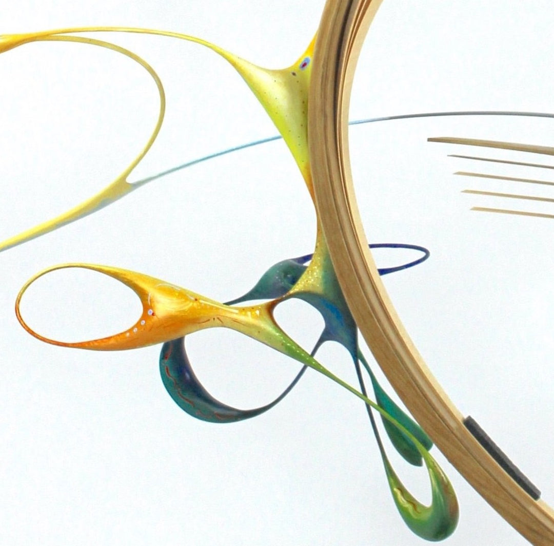 Freedom by Mark Purllant, an award-winning one-off mixed media sculpture in carved and steam-bent English oak with painted sculptural forms, maple veneer, ebony, and brass details, mounted on a scorched oak base with flowing, dynamic curves in yellow, blue, orange, and green.