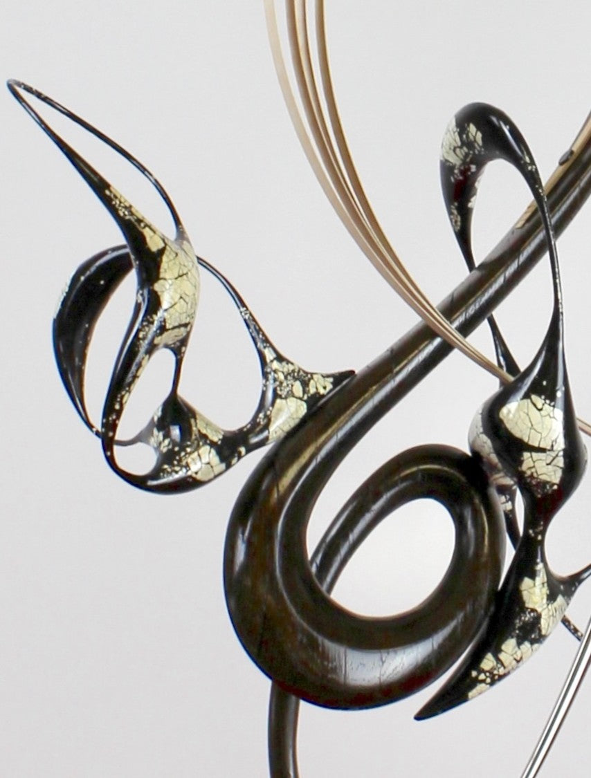 Katana by Mark Purllant, a one-off mixed media sculpture crafted from ancient bog oak with black Japanning and eggshell inlay, combined with whitened maple veneer and polished stainless steel, evoking Japanese elegance and controlled strength.